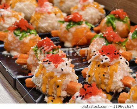 Delicious sushi rolls are beautifully arranged on plates Delicious sushi rolls are beautifully arranged on plates 119662624