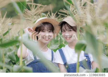 Young women standing in a farm Young women standing in a farm 119663085