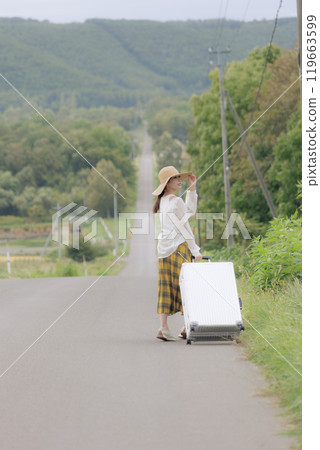 Young woman traveling alone 119663599