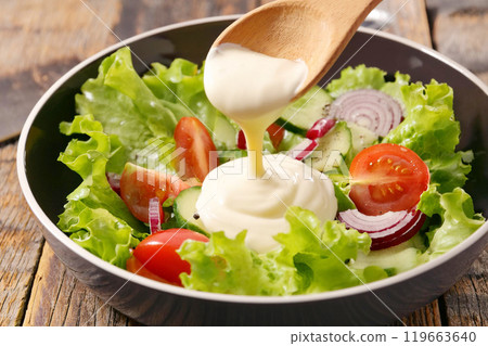 Put mayonnaise on salad 119663640