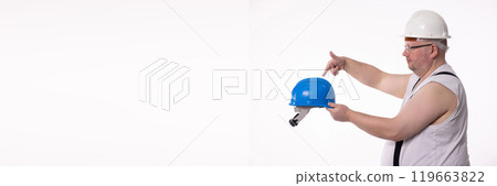 A Construction Worker Illustrating the Vital Importance of Wearing a Safety Helmet for Protection A Construction Worker Illustrating the Vital Importance of Wearing a Safety Helmet for Protection 119663822