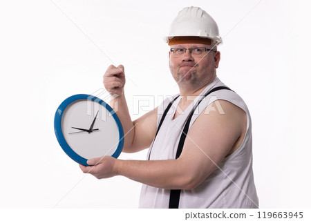 A Worker Holding a Clock While Dressed in Construction Gear and Safety Equipment A Worker Holding a Clock While Dressed in Construction Gear and Safety Equipment 119663945