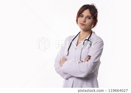 Confident Female Doctor Wearing a White Coat and Holding a Stethoscope, Ready to Help 119664027