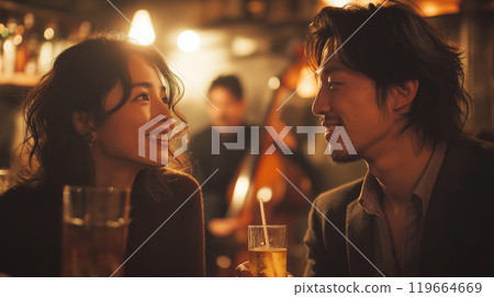 Young couple enjoying live music at a jazz bar Young couple enjoying live music at a jazz bar 119664669