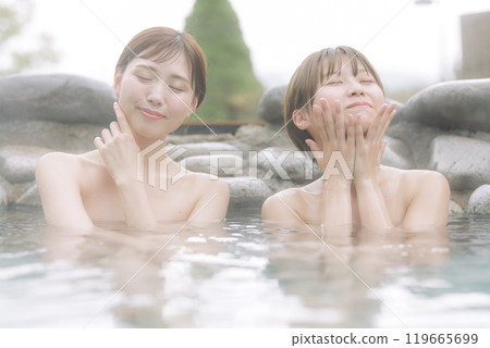 Young women relaxing in an open-air bath 119665699