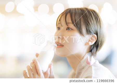 Young woman relaxing after a bath 119666396