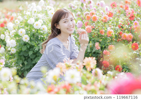 A woman surrounded by flowers A woman surrounded by flowers 119667116