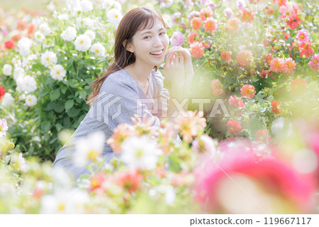 A woman surrounded by flowers A woman surrounded by flowers 119667117