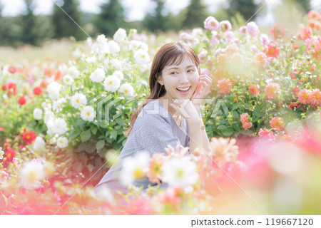 A woman surrounded by flowers A woman surrounded by flowers 119667120