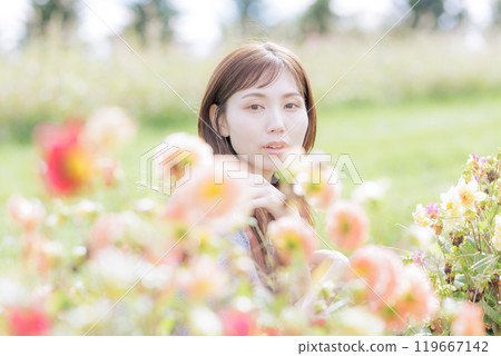 A woman surrounded by flowers 119667142