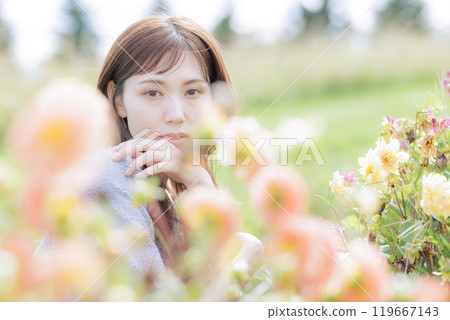 A woman surrounded by flowers 119667143