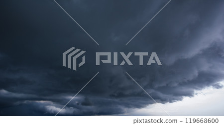 Bad or moody weather sky and environment. carbon dioxide emissions, greenhouse effect, global warming, climate change. The dark sky with heavy clouds converging and a violent storm before the rain. Bad or moody weather sky and environment. carbon dioxide emissions, greenhouse effect, global warming, climate change. The dark sky with heavy clouds converging and a violent storm before the rain. 119668600