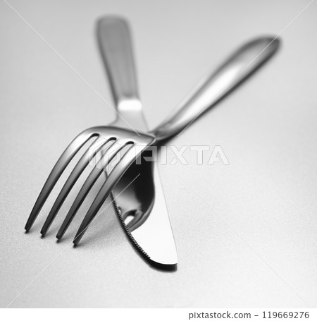 Fork and knife on table 119669276