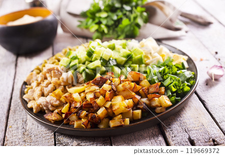 ingredients for salad. chicken, fried potato and vegetables 119669372