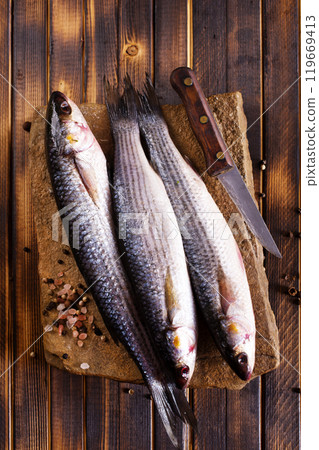 Gray Mullet Fish (Kefal) on stone board 119669413