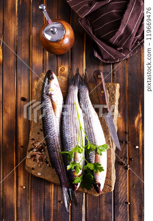 Gray Mullet Fish (Kefal) on stone board Gray Mullet Fish (Kefal) on stone board 119669476