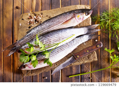 Gray Mullet Fish (Kefal) on stone board Gray Mullet Fish (Kefal) on stone board 119669479