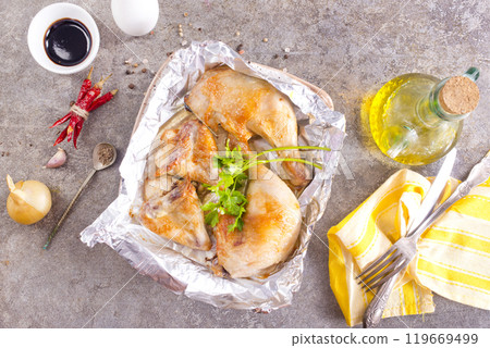 Chicken baking with spice and salt 119669499
