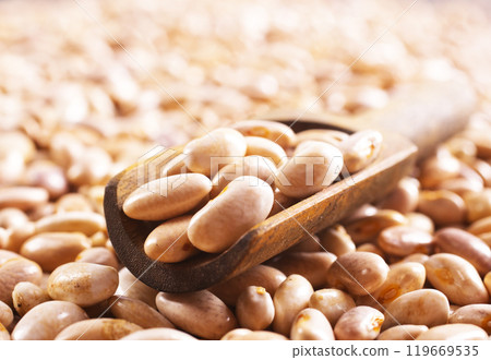 Beans and wooden spoon on a table, copy spase Beans and wooden spoon on a table, copy spase 119669535