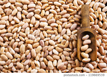 Beans and wooden spoon on a table, copy spase 119669539