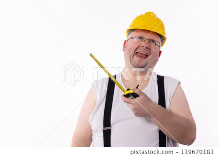 A cheerful construction worker using a measuring tape, showing a positive attitude and skill 119670181