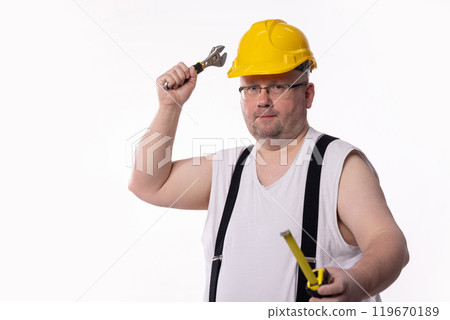 A Construction Worker with essential tools and appropriate safety gear for the task A Construction Worker with essential tools and appropriate safety gear for the task 119670189