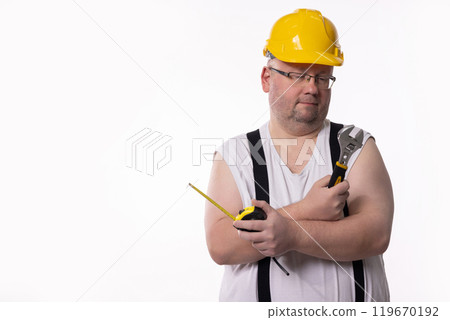 A Construction Worker Dressed in Casual Attire, Equipped with Various Tools Ready for Use 119670192