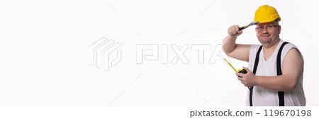 A humorous construction worker fully equipped with various tools and essential safety gear 119670198