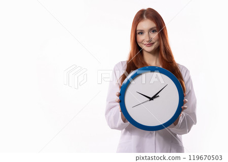 A Smiling Woman Holding a Clock Against a Bright, Clean White Background for Context A Smiling Woman Holding a Clock Against a Bright, Clean White Background for Context 119670503