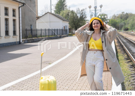 On the threshold of impressions: the image of the traveler conveys the expectation of discoveries and opportunities during a tourist trip. Under the sign of rest: a woman with a suitcase expresses her On the threshold of impressions: the image of the traveler conveys the expectation of discoveries and opportunities during a tourist trip. Under the sign of rest: a woman with a suitcase expresses her 119671443