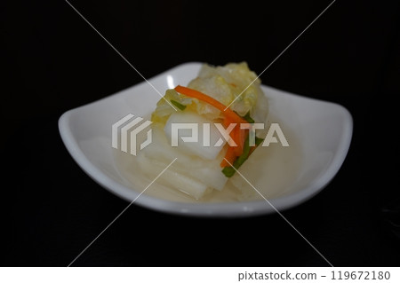 White kimchi is a type of kimchi made without using red pepper powder in Korean cuisine 119672180