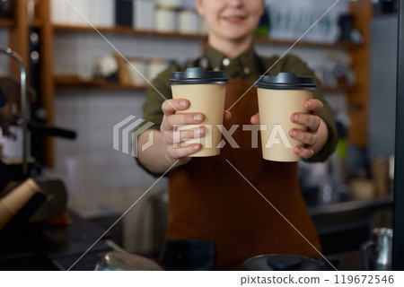 Closeup view of double portion of coffee drinks in paper cups 119672546