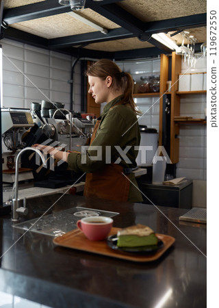 Portion of morning coffee in ceramic cup and cheesecake dessert piece Portion of morning coffee in ceramic cup and cheesecake dessert piece 119672550