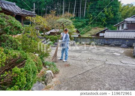 Woman sweeping the garden Countryside Old house Inn Life Woman sweeping the garden Countryside Old house Inn Life 119672961
