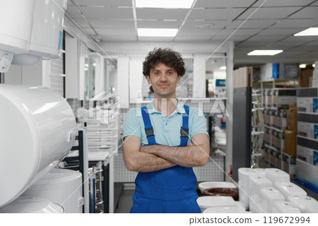 Friendly smiling salesman advisor selling water heating tanks Friendly smiling salesman advisor selling water heating tanks 119672994