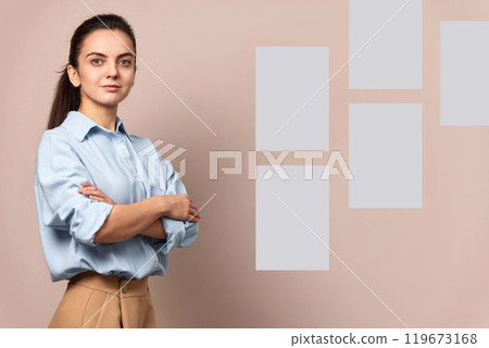 Confident pretty businesswoman near sticky papers on wall, female leader, mock up, Project and schedule concept 119673168