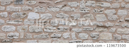 Old street road made of stones connected by concrete 119673500
