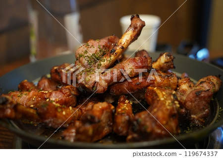 Boiled pork back ribs seasoned and grilled. The meat on the bone is chewy and delicious 119674337