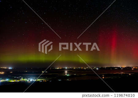 The Aurora Borealis, the northern lights, showing up above Maghery, Burtonport, Arranmore and Dungloe in County Donegal, Ireland. 119674810