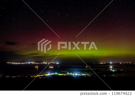 The Aurora Borealis, the northern lights, showing up above Maghery, Burtonport, Arranmore and Dungloe in County Donegal, Ireland. 119674822