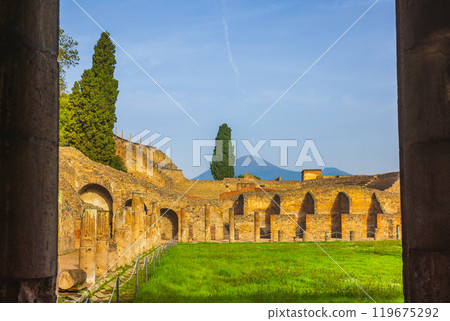 Ancient ruins of Pompei surrounded by lush greenery near Vesuvius volcano 119675292