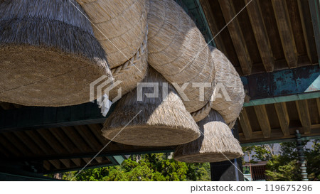 The large shimenawa (sacred rope) at the Izumo Taisha Kagura Hall The large shimenawa (sacred rope) at the Izumo Taisha Kagura Hall 119675296