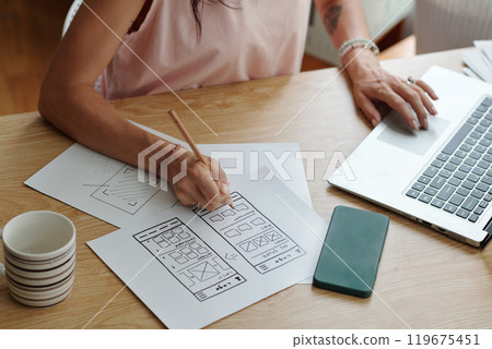 Designing User Interface on Digital Tablet in Office 119675451