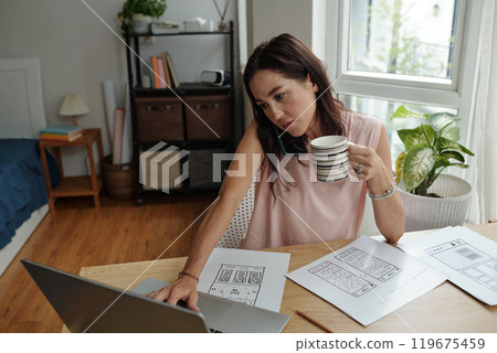 Working From Home and Analyzing Documents with Coffee Working From Home and Analyzing Documents with Coffee 119675459