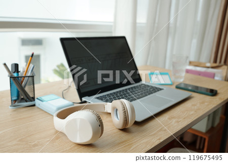 Modern Workspace Featuring Laptop and Headphones 119675495