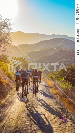 Cyclists traverse a picturesque trail surrounded by mountains and forest, showcasing their fitness and endurance on a summer journey through nature,shared hobby for a group of people, deep connections Cyclists traverse a picturesque trail surrounded by mountains and forest, showcasing their fitness and endurance on a summer journey through nature,shared hobby for a group of people, deep connections 119676950