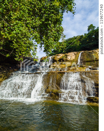 Waterfalls with multi-tiered level rock structures. Tinuy-an Falls in Surigao del Sur. Philippines. 119677240