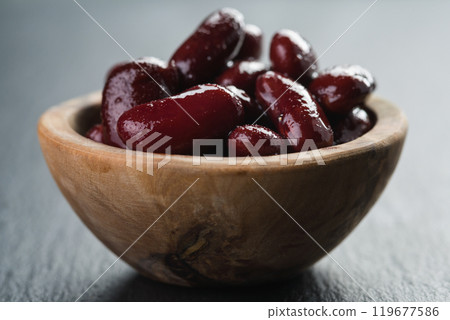 red canned beans in wood bowl on slate background red canned beans in wood bowl on slate background 119677586