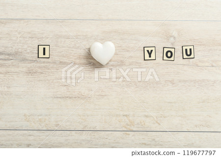 Romantic I Love You message on wood with a marble heart 119677797