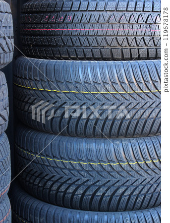 Rubber Surface Texture Of New Winter Tires Stacked In A Pile. Non Studded New Tires For Winter Conditions 119678178
